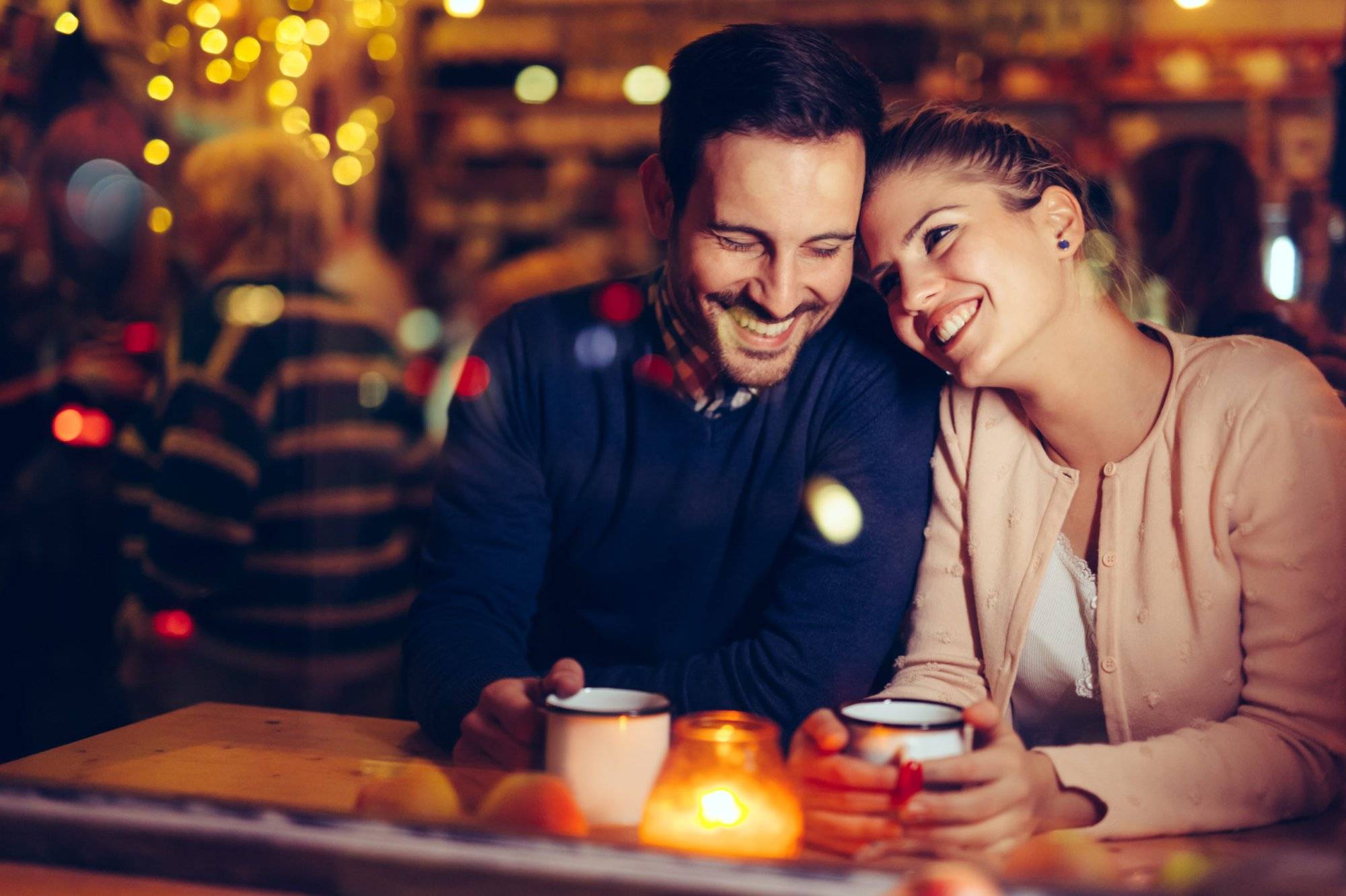 Romantic couple dating in pub at night