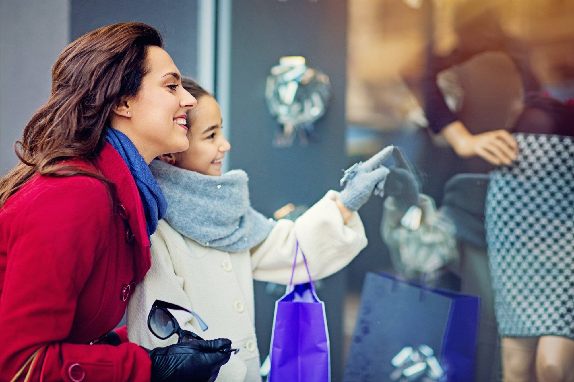 Mother and daughter are walking on the street